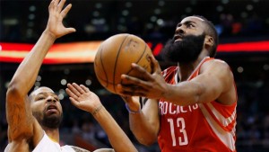 The Rockets' James Harden drives past the Suns' Marcus Morris.