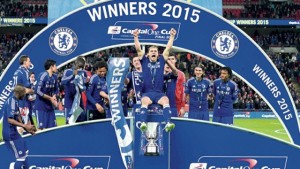 Chelsea’s Serbian defender Branislav Ivanovic celebrates with teammates during the presentation after Chelsea won the League Cup final against cross-town rivals Tottenham Hotspur at Wembley Stadium in London, yesterday. Chelsea won 2-0. (PHOTOS: AFP)