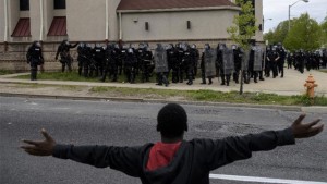 A protestor gestures towards the riot police in Baltimore, Maryland, on April 27, 2015 (AFP Photo/Brendan Smialowski) 