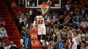 Heat forward James Ennis dunks the ball past Magic center Dewayne Dedmon.