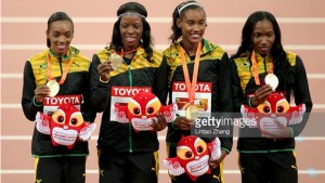 (From left) Chistine Day, Shericka Jackson, Stephenie-Ann McPherson, and Novlene Williams- Mills pose with their gold medals