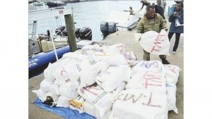 A Bahamian official offloads bales of marijuana in Nassau, Bahamas, September 6, 2015. The contraband was seized during an interagency operation designed to combat drug smuggling to and from the Bahamas. US Coast Guard photo