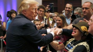 Republican presidential candidate, businessman Donald Trump, greets supporters after speaking at an event sponsored by the Greater Charleston Business Alliance and the South Carolina African American Chamber of Commerce at the Charleston Area Convention Center in North Charleston, S.C., Wednesday, Sept. 23, 2015. (AP Photo/Mic Smith)