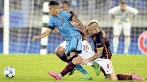 Barcelona’s Brazilian forward Neymar (centre) is tackled by Roma’s Belgian midfielder Radja Nainggolan (right) and midfielder Seydou Keita during their UEFA Champions League match at Rome Olympic stadium, yesterday. The match ended 1-1.