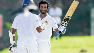 Sri Lanka batsman Dimuth Karunaratne celebrates his century on day one of the first Test match against the West Indies at the International Cricket Stadium, Galle, Sri Lanka, yesterday.