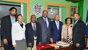 (L-R) Andre Amritt; Kerryanne Amritt; Edmund Morton; Governor-General Tapley Seaton; Governor-General's Deputy Dennis Michael Morton; Cynthia "Junie" Morton; Nigel Morton. 