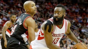 Rockets guard James Harden scores 45 points, including all nine of Houston's points in overtime, against Gerald Henderson and the Trail Blazers at Toyota Center. 