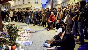 PEOPLE PAY TRIBUTE OUTSIDE LE CARILLON BAR, THE DAY AFTER A DEADLY ATTACK ON FRIDAY NIGHT IN PARIS. 