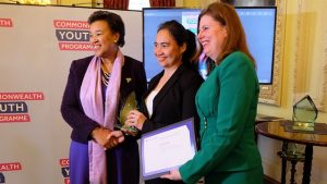 Commonwealth Secretary-General Scotland presents Manuela Lue of Belize with her Commonwealth Youth Worker of the Year Awards for the Caribbean and Americas